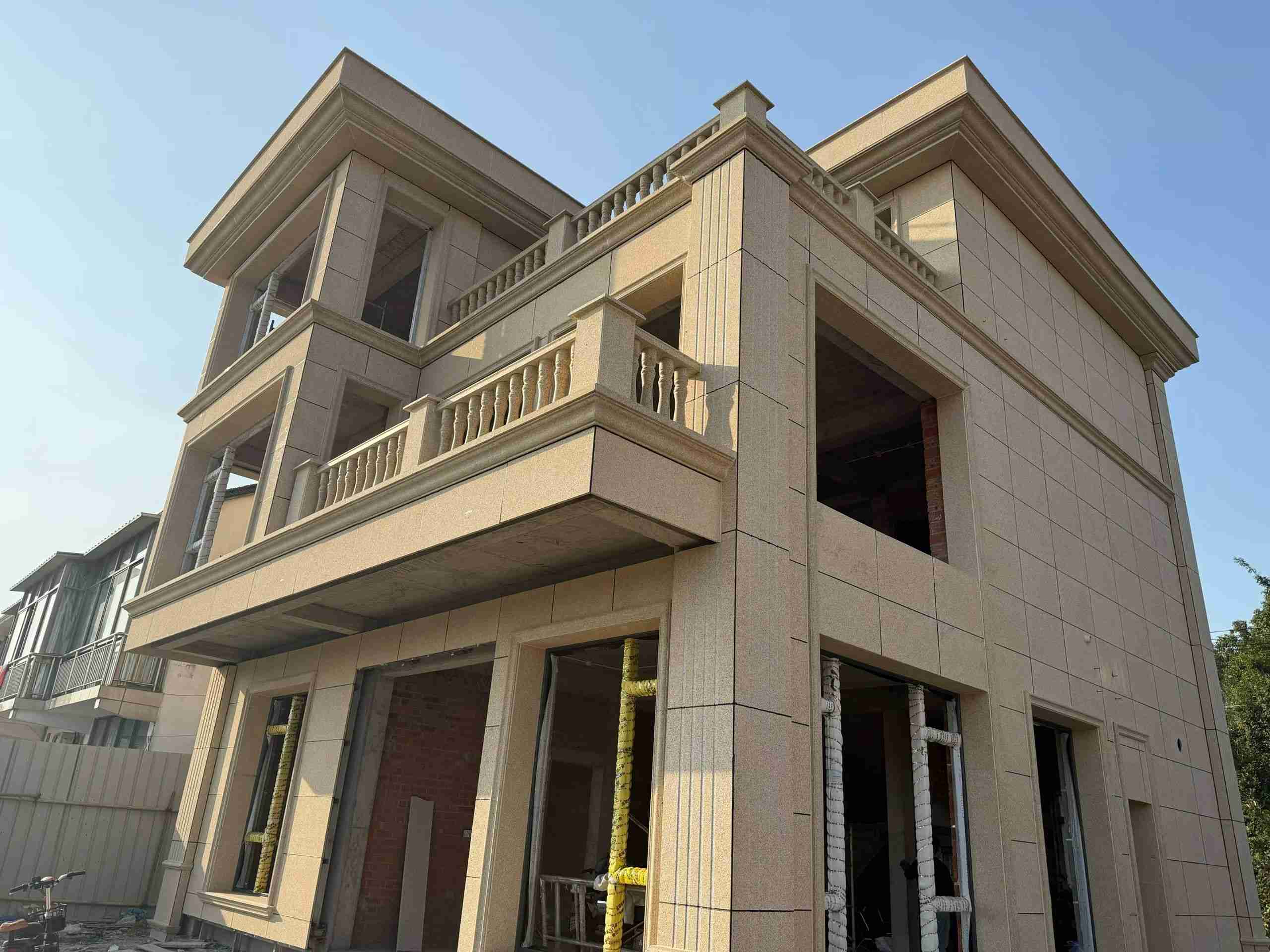 泉州 黄金麻花岗岩石材荔枝面外墙干挂效果展示